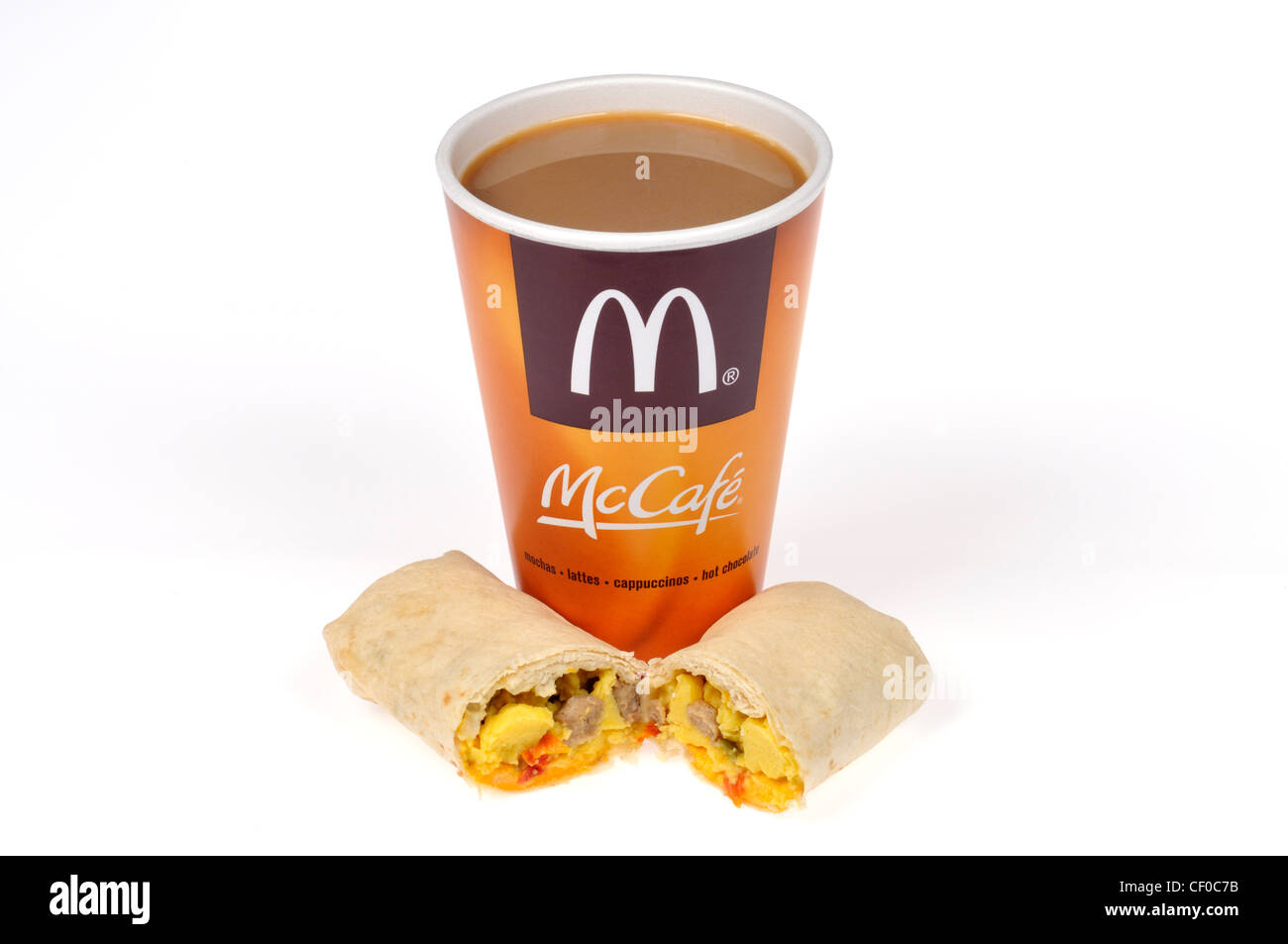 McDonalds breakfast burrito with eggs and sausage and cup of McCafe hot coffee on white cut out USA Stock Photo