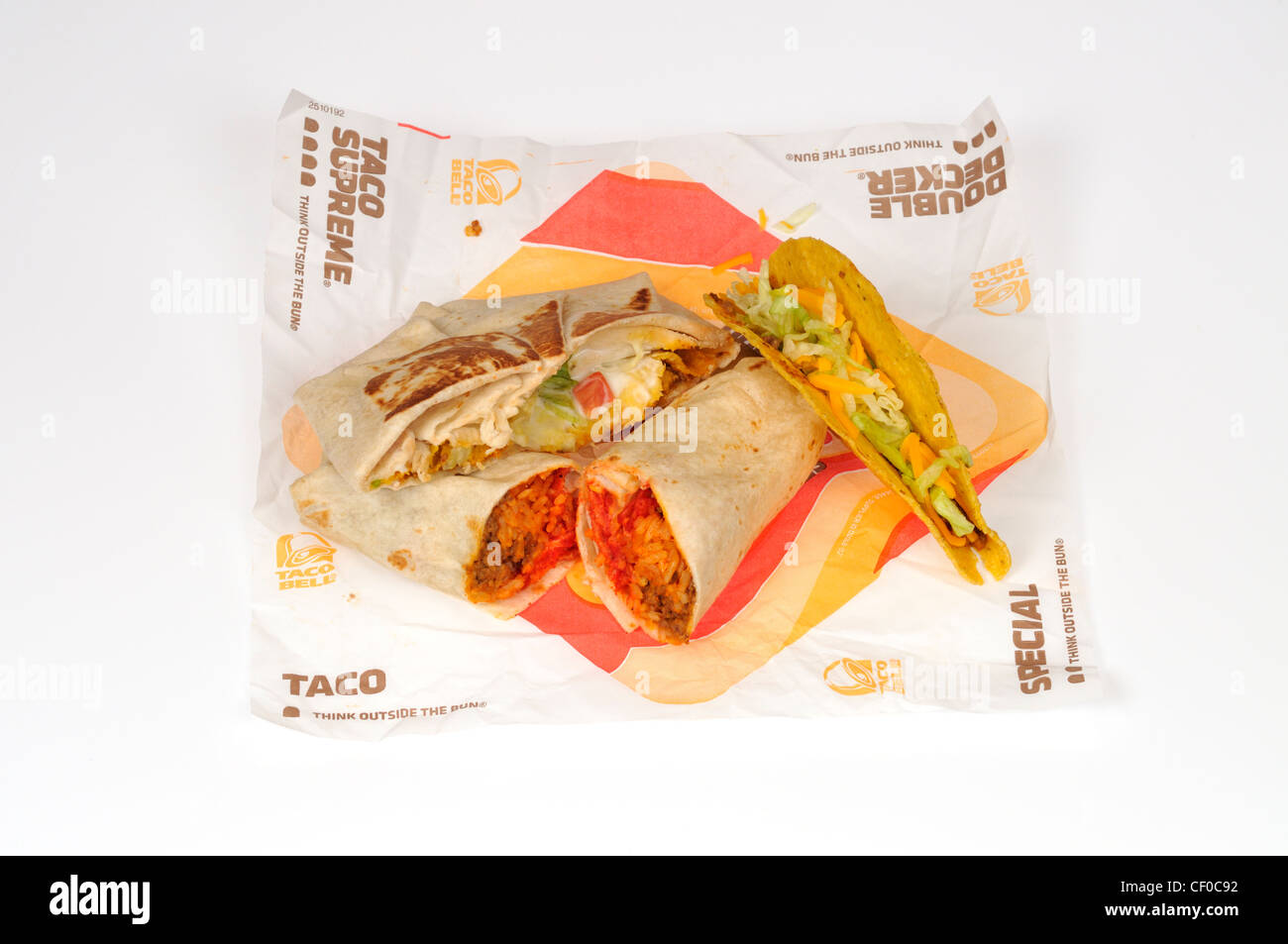 Taco Bell burrito, taco and crunchwrap supreme on wrapper on white background cutout Stock Photo