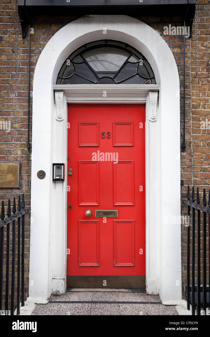 Elegant black and red front doors, Greater London, England, UK