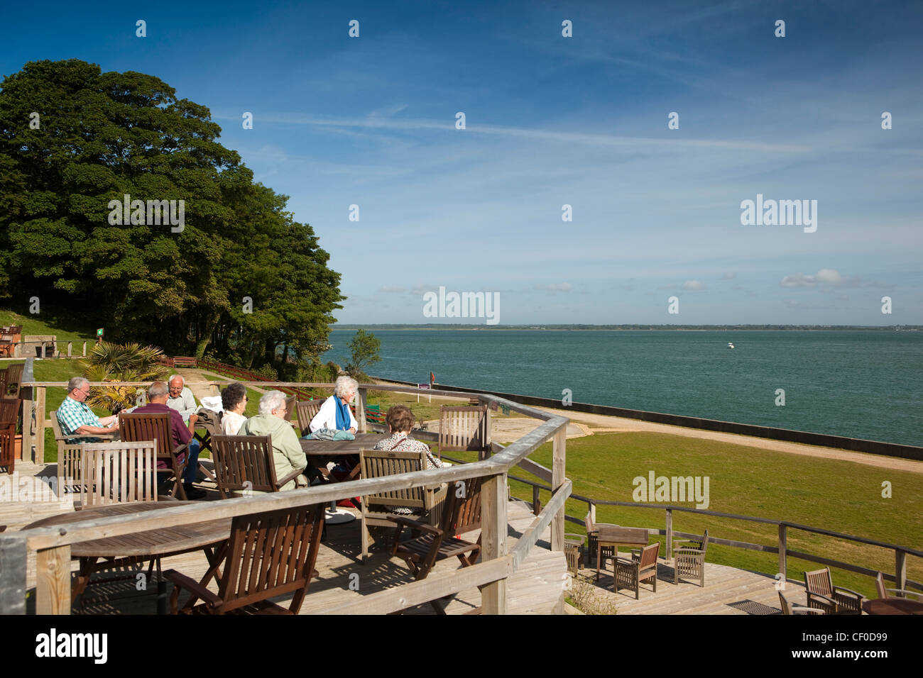 UK, England, Isle of Wight, Norton Grange, Warners Coastal Resort, visitors on terrace overlooking the Solent Stock Photo