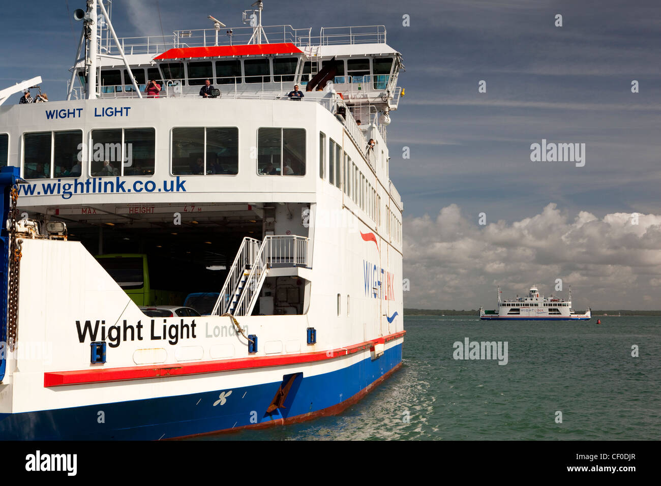 UK, England, Isle of Wight, Yarmouth, Wightlink Ferry Wight Light departing whilst Wight Sun waits to dock Stock Photo