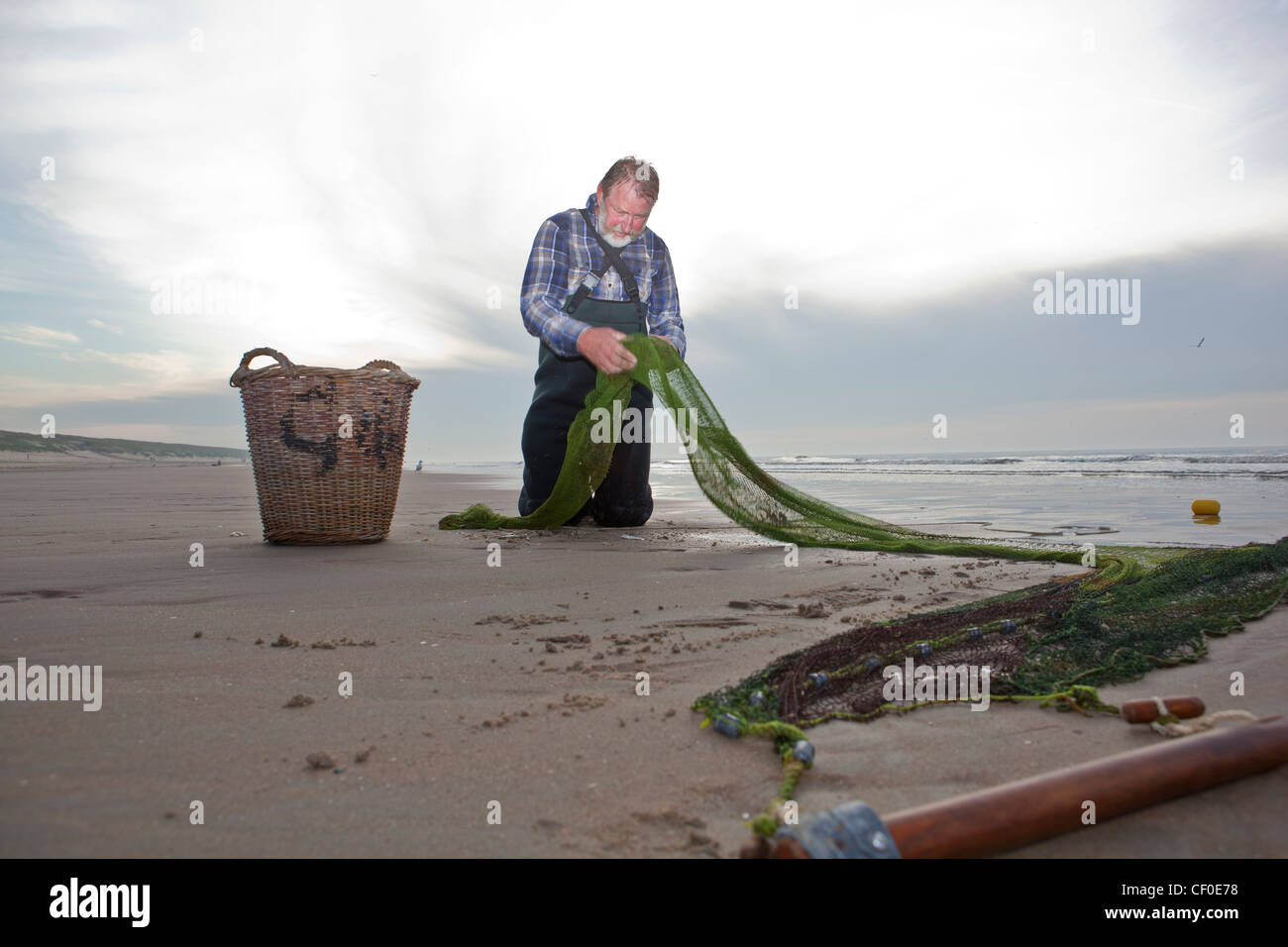 Man traditional fishing beach of Noordwijk Holland Europe Stock Photo