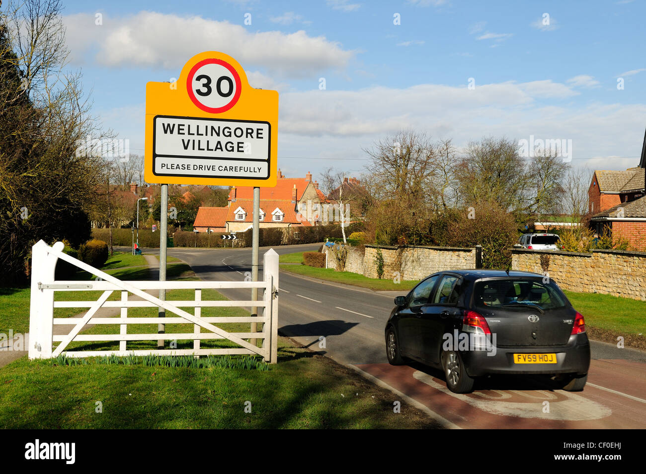 Wellingore Village Lincolnshire.Village Sign (please drive carefully) 30MPH. Stock Photo