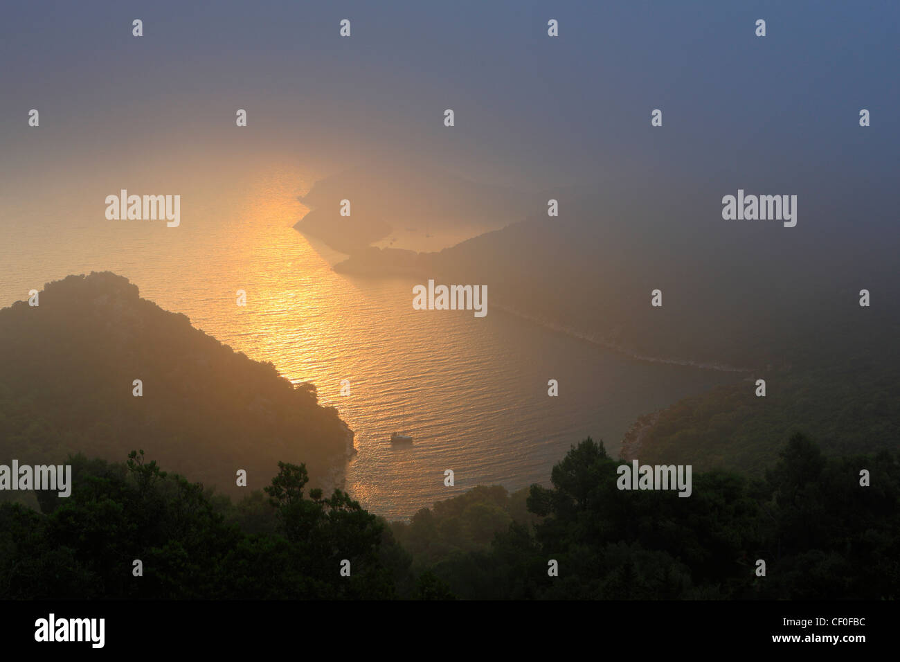 Misty sunrise at the Croatian island of Lastovo. Zaklopatica bay. Stock Photo