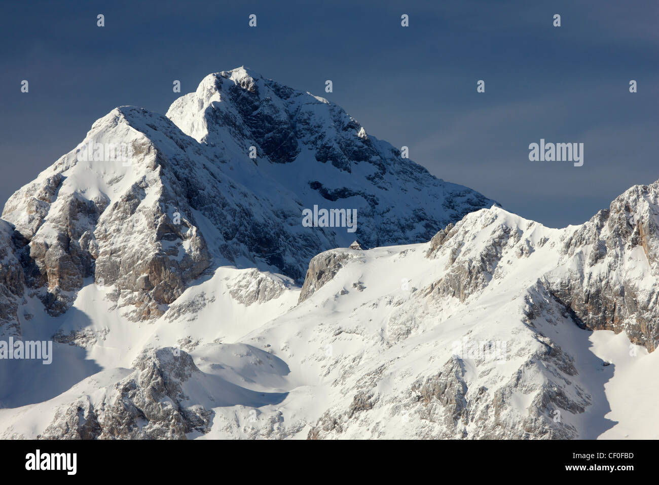 Snow covered Triglav mount in winter - Slovenia Stock Photo