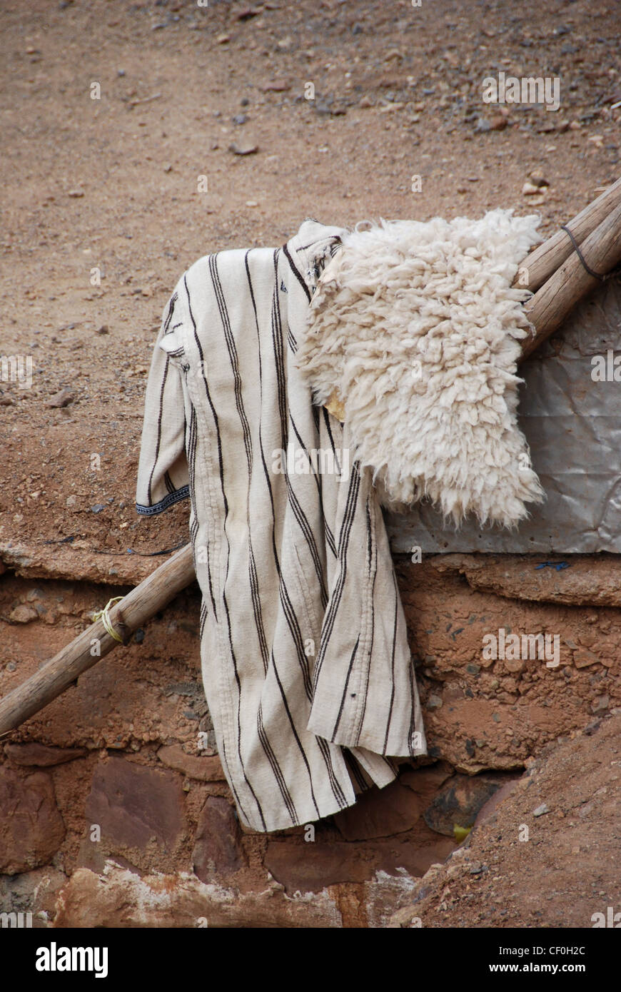 Traditional djellabah and sheepskin  in Berber village, Atlas Mountains, Morocco, Africa Stock Photo