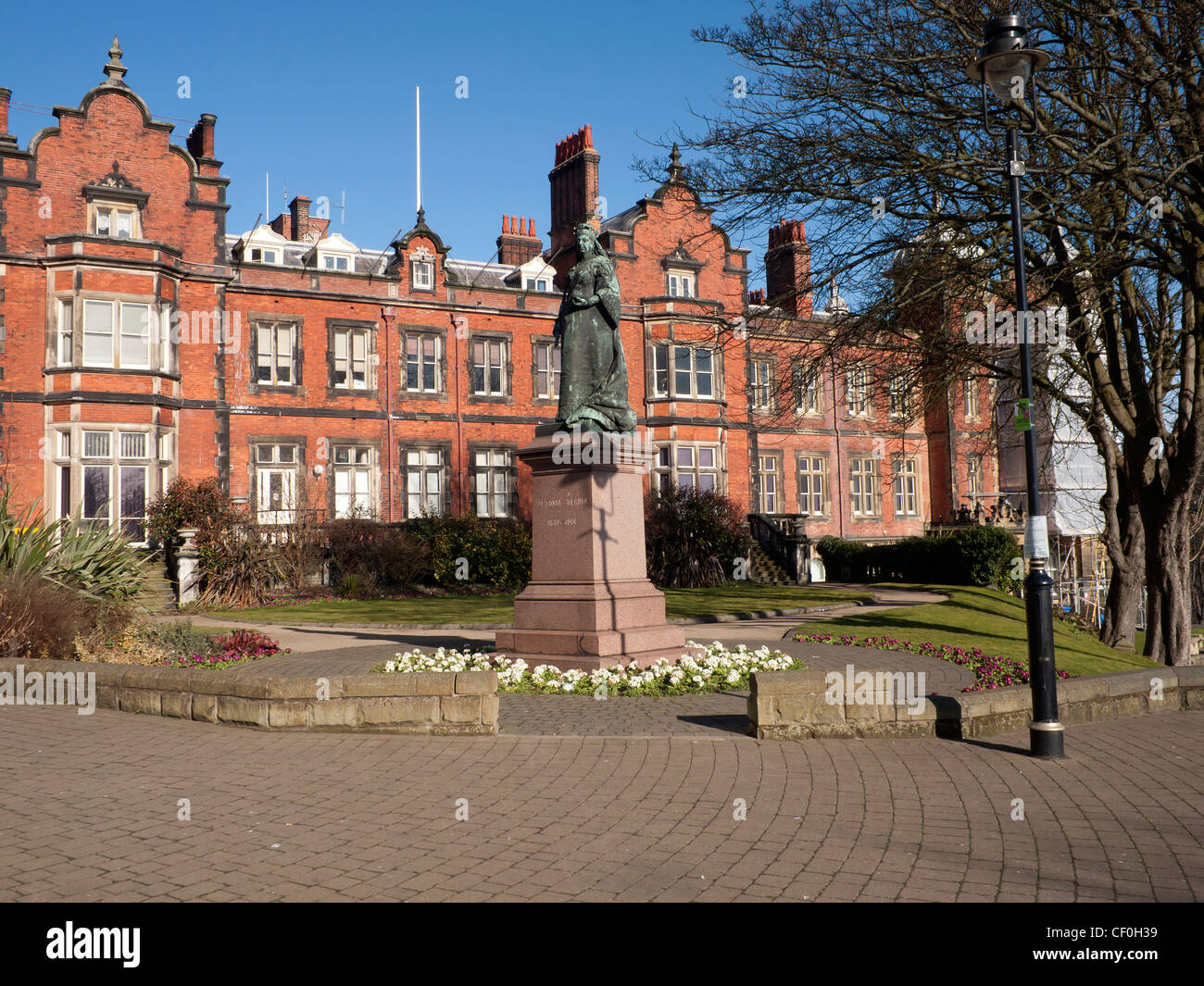 Scarborough Town Hall with a statue of Queen Victoria in front built for a banker in 1846 purchased by Scarborough Council 1899 Stock Photo