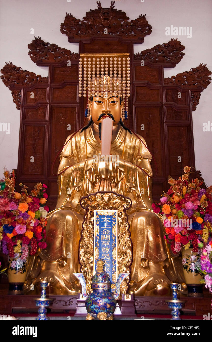 Golden statue of a religious figure Baiyun temple in Shanghai (China