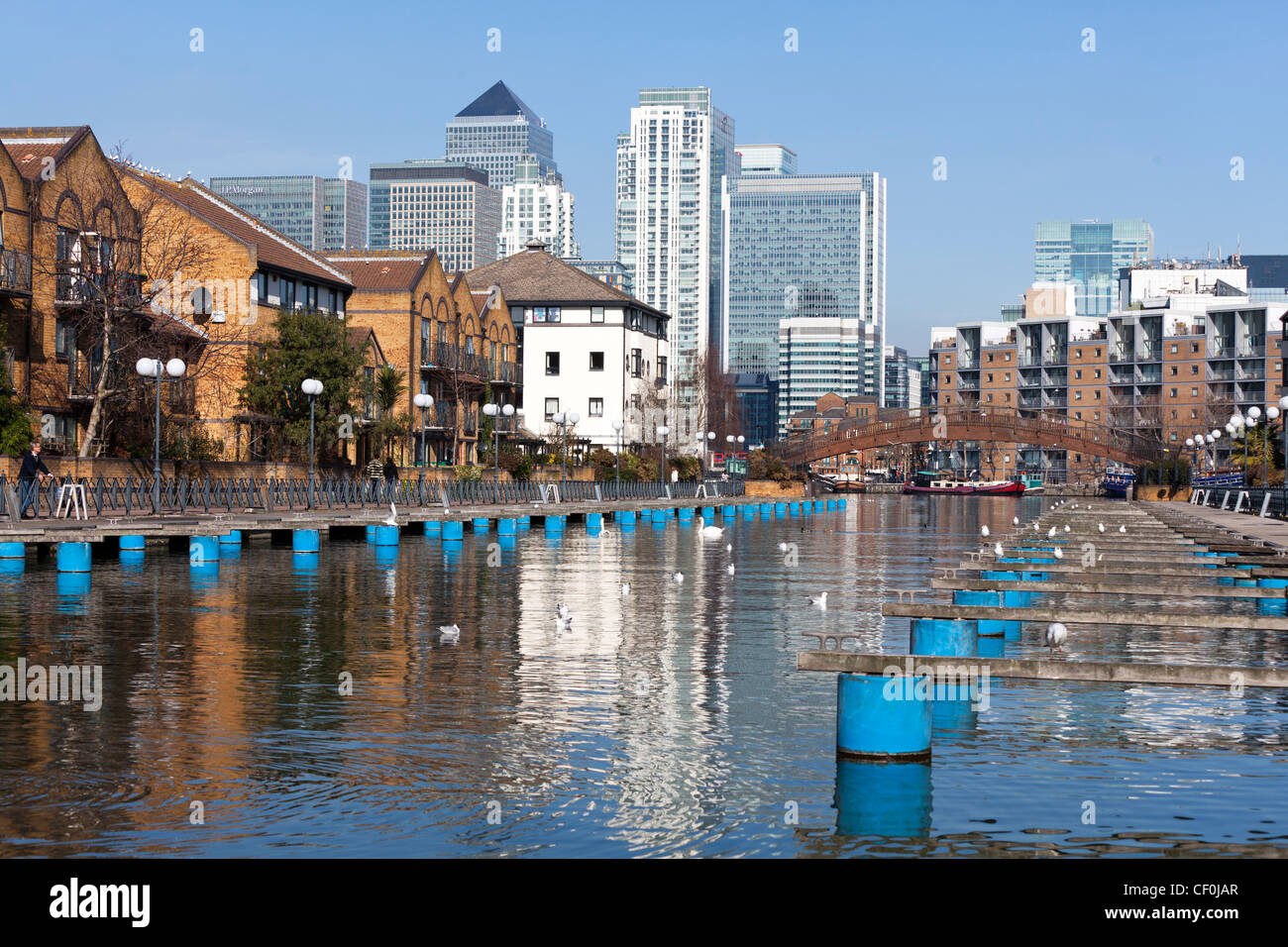 Clippers Quay marina, part of Millwall Outer Dock with Canary wharf in the background, Isle of Dogs, Tower Hamlets, London, UK. Stock Photo