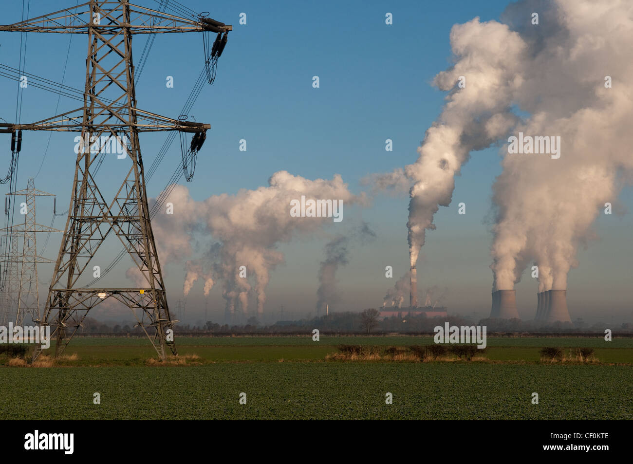 electricity-pylons-with-coal-fired-power-station-in-the-background