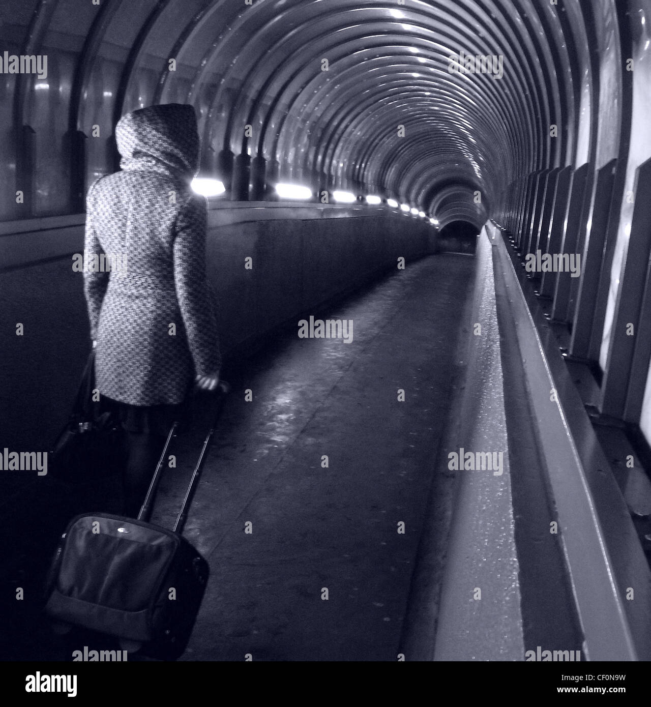 Walker at Park lane Darlington Passenger Tunnel with luggage, Darlington Station, Darlington, Teeside England, UK Stock Photo