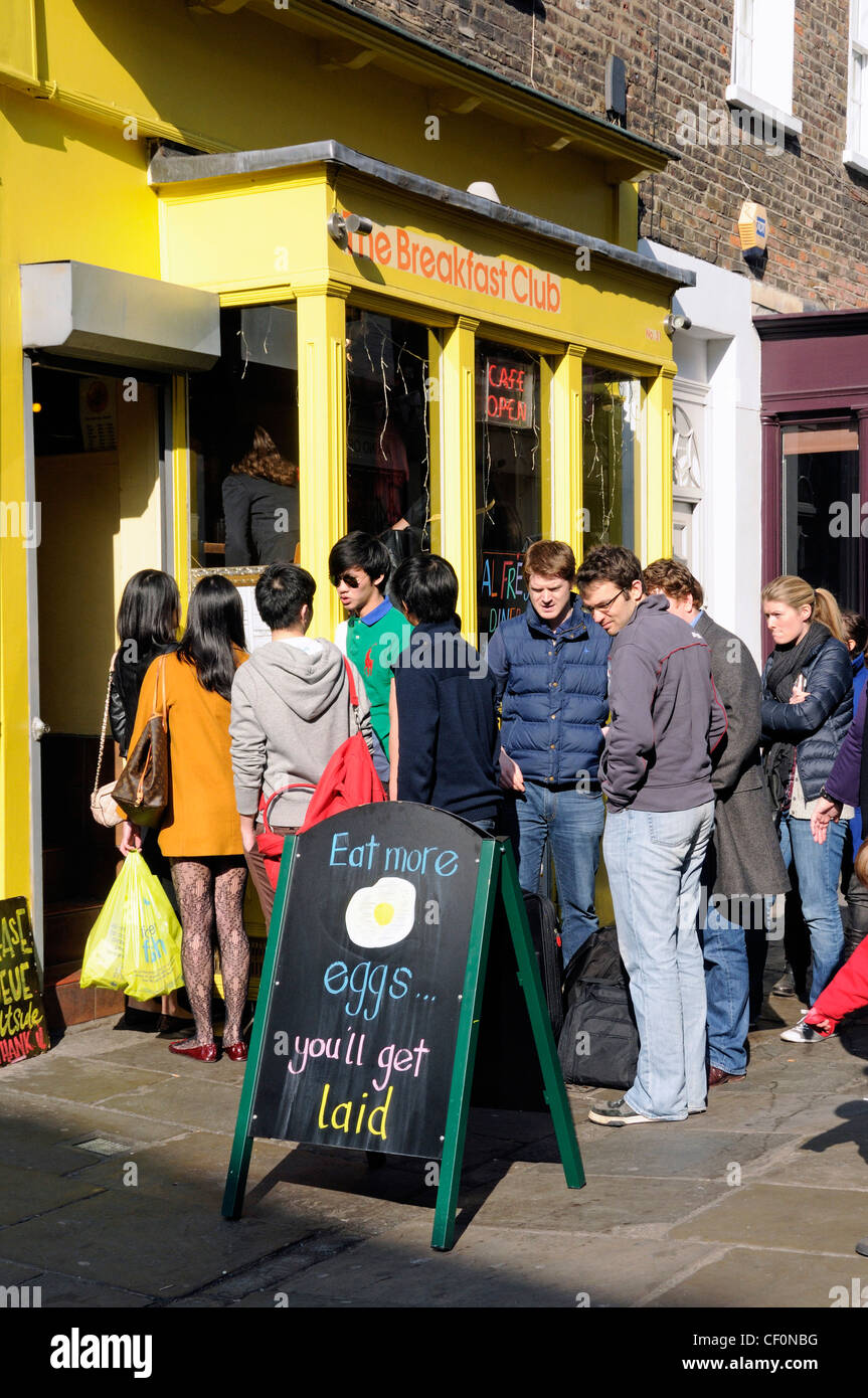 Queue of people outside The Breakfast Club Camden Passage, Islington London England UK Stock Photo