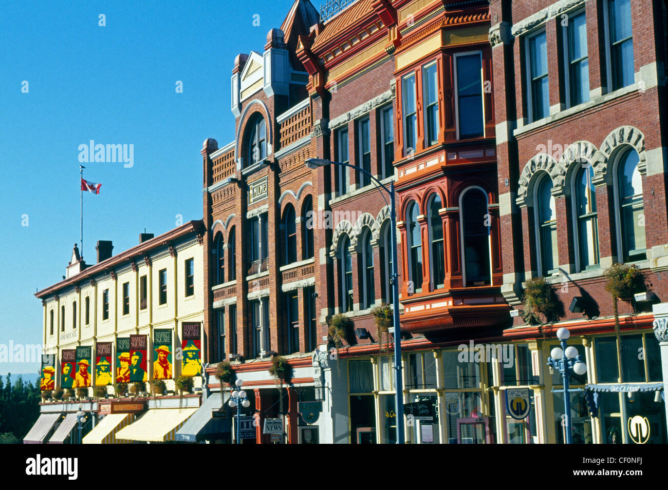 Market Square has popular shopping and dining spots in historical 19th-century brick-and-beam buildings in downtown Victoria, British Columbia, Canada. Stock Photo