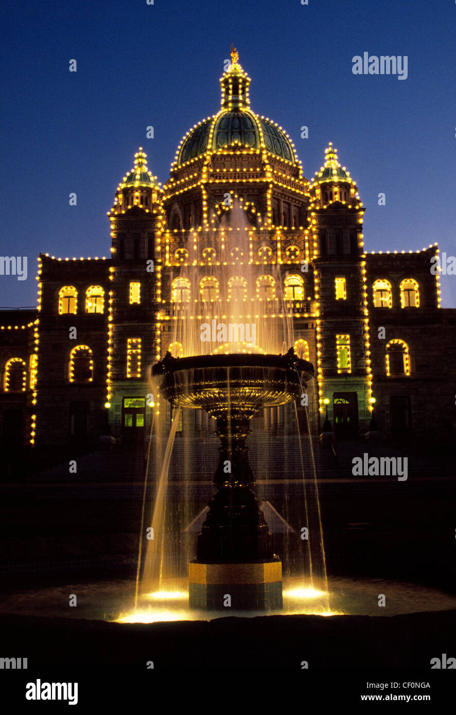 Lights at night illuminate the ornate 1890s Parliament Buildings on Vancouver Island in Victoria, the capital city of British Columbia, Canada. Stock Photo