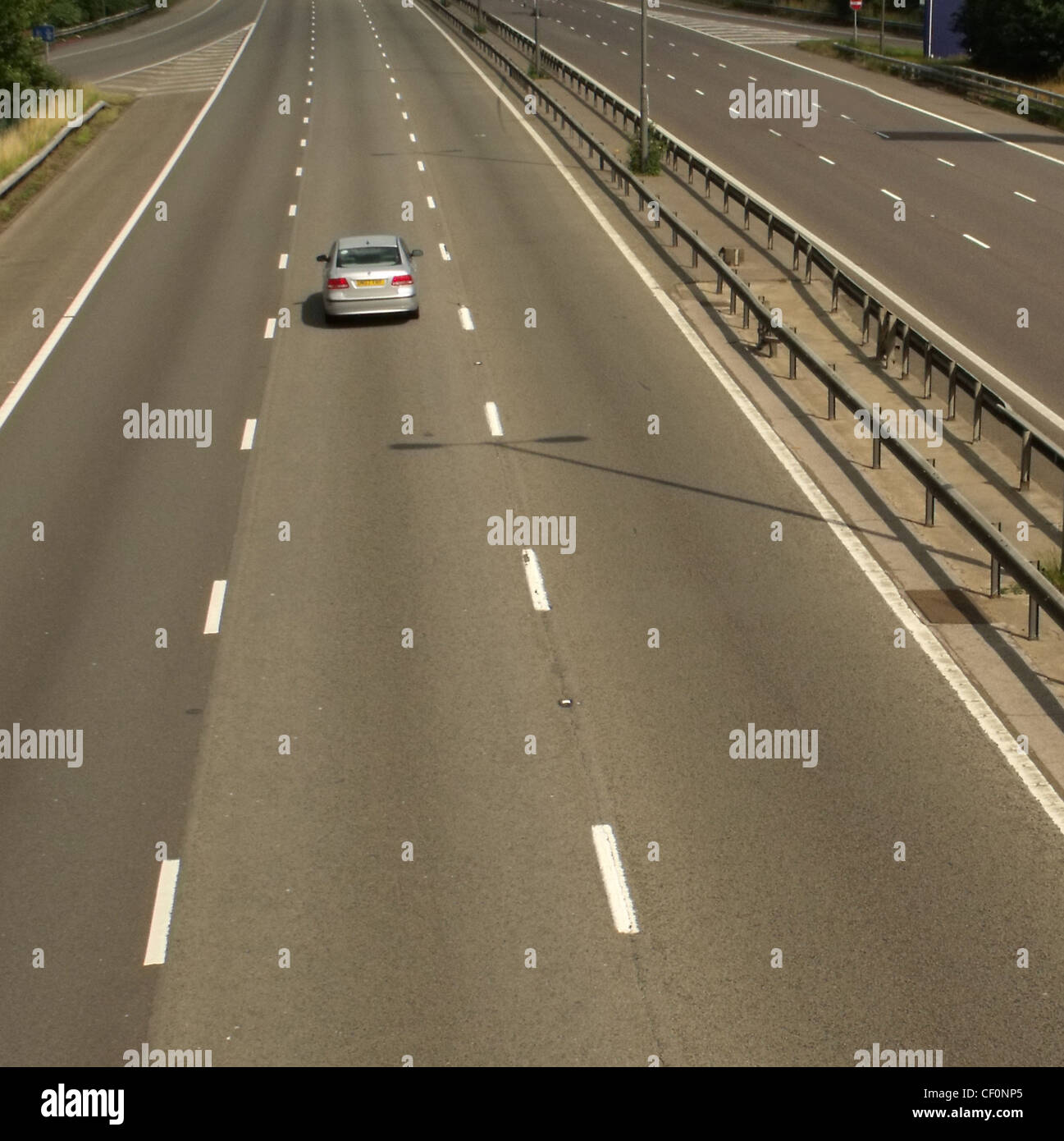 A Single car on M1, near Watford Gap services, M1 Motorway, Northamptonshire, England UK Stock Photo