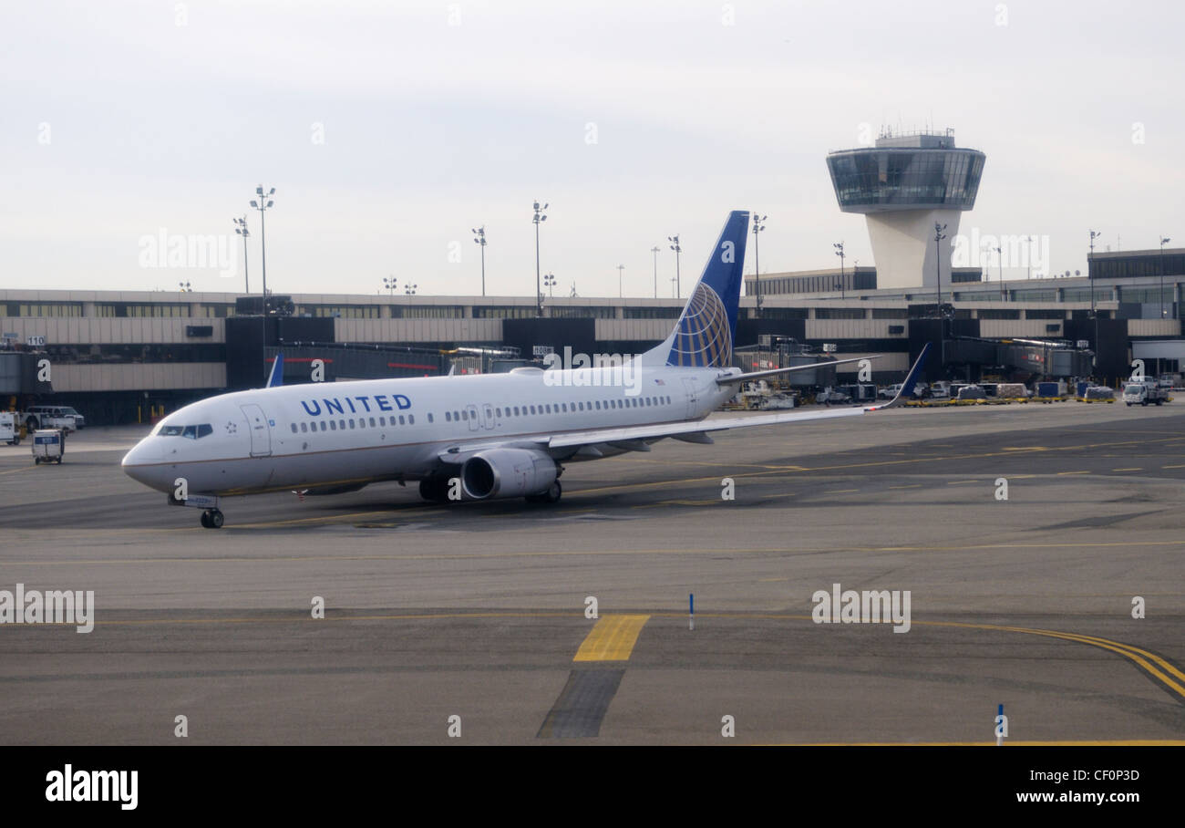 Commercial airliner on runway at Newark Liberty International Airport, Newark, NJ Stock Photo