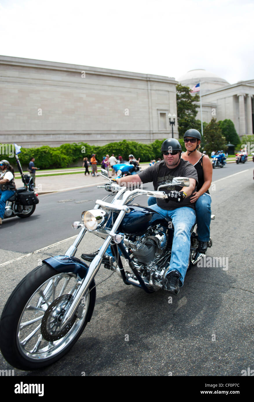 Two people on a motorcycle Rolling Thunder Memorial Day 2011 Washington DC Stock Photo