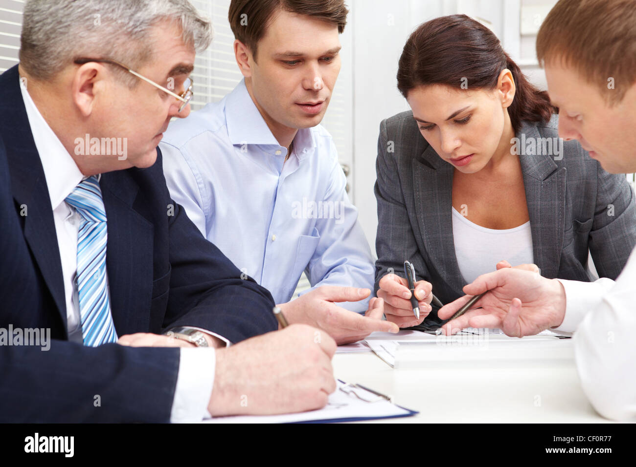 Business group discussing the future perspectives of the strategy Stock Photo