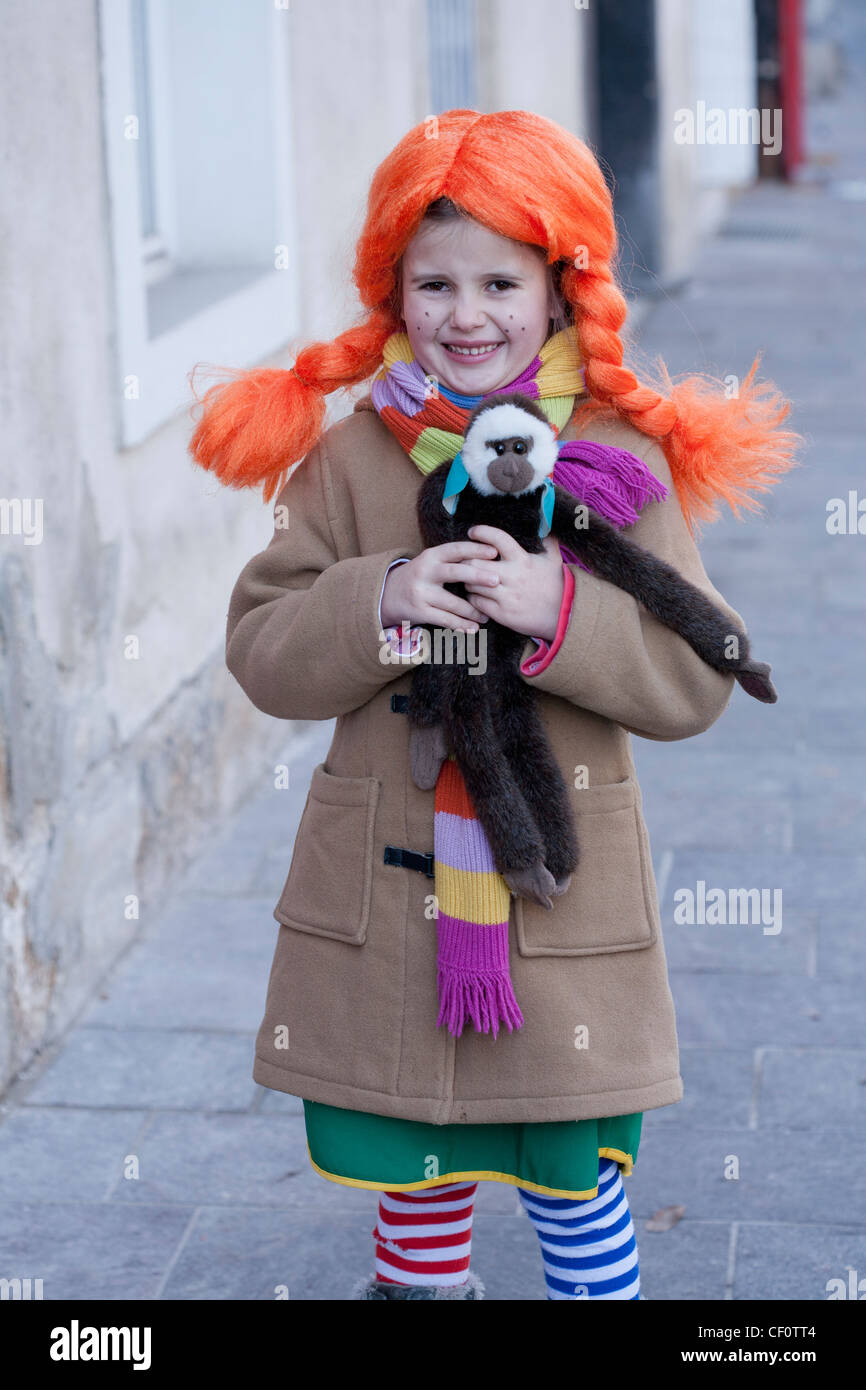 Little girl dressed like Pippi Longstocking smiling Stock Photo - Alamy