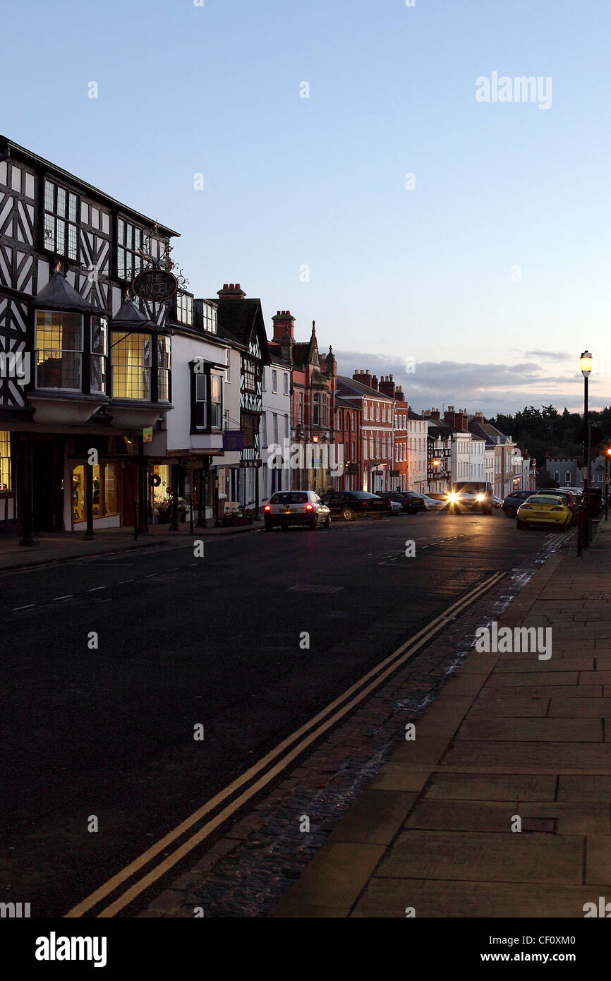 Black and White timbered buildings and Georgian architecture in Broad Street,Ludlow at dusk. Stock Photo