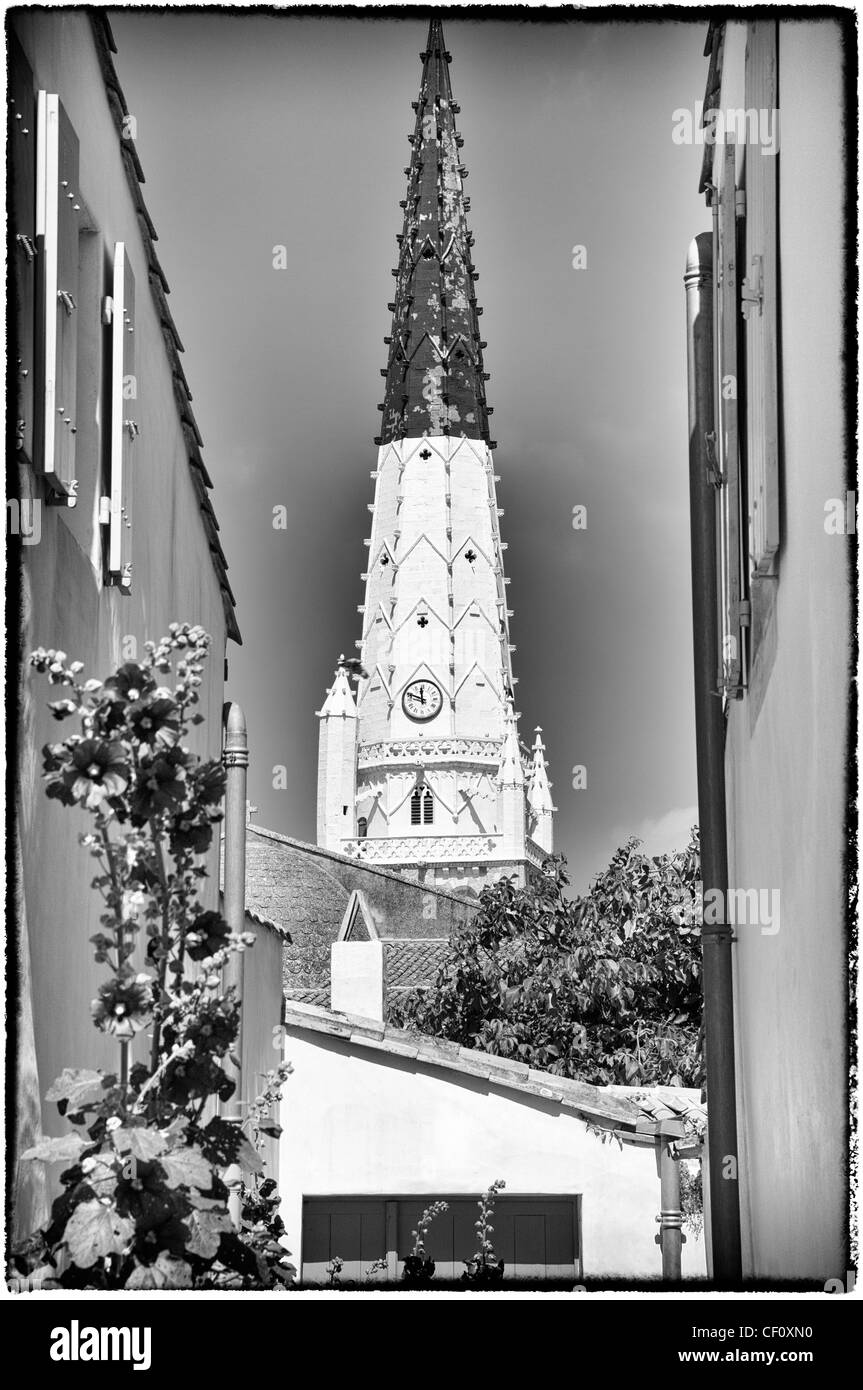 Church Saint Etienne, Bell tower and Hollyhock (Alcea Rosa), Ars en Re, Ile de Re, France Stock Photo