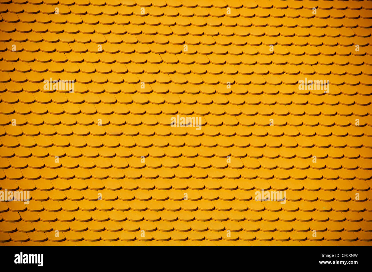 yellow clay roof tile background Stock Photo - Alamy