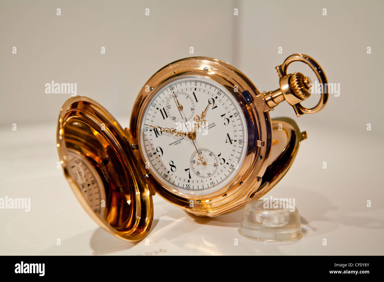 A valuable mechanical pocket watch made of gold. Stock Photo