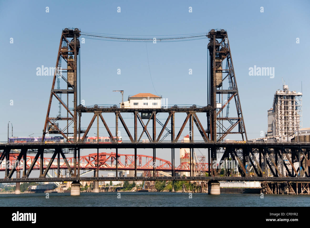 MAX Light Rail Train crossing the Willamette River on the Steel Bridge, Portland Oregon, USA. Stock Photo