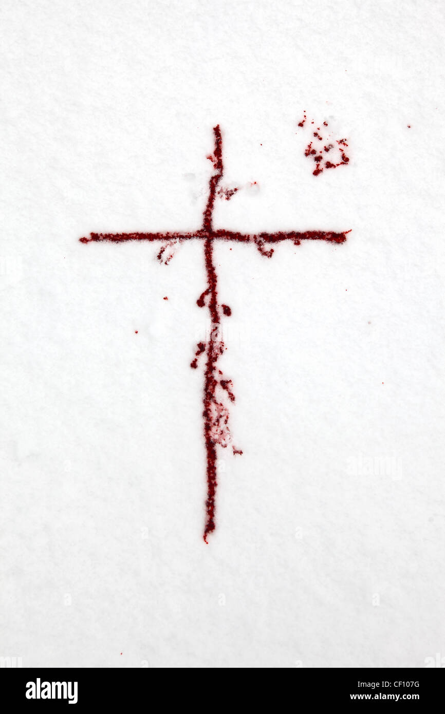 a cross of blood in the snow Stock Photo