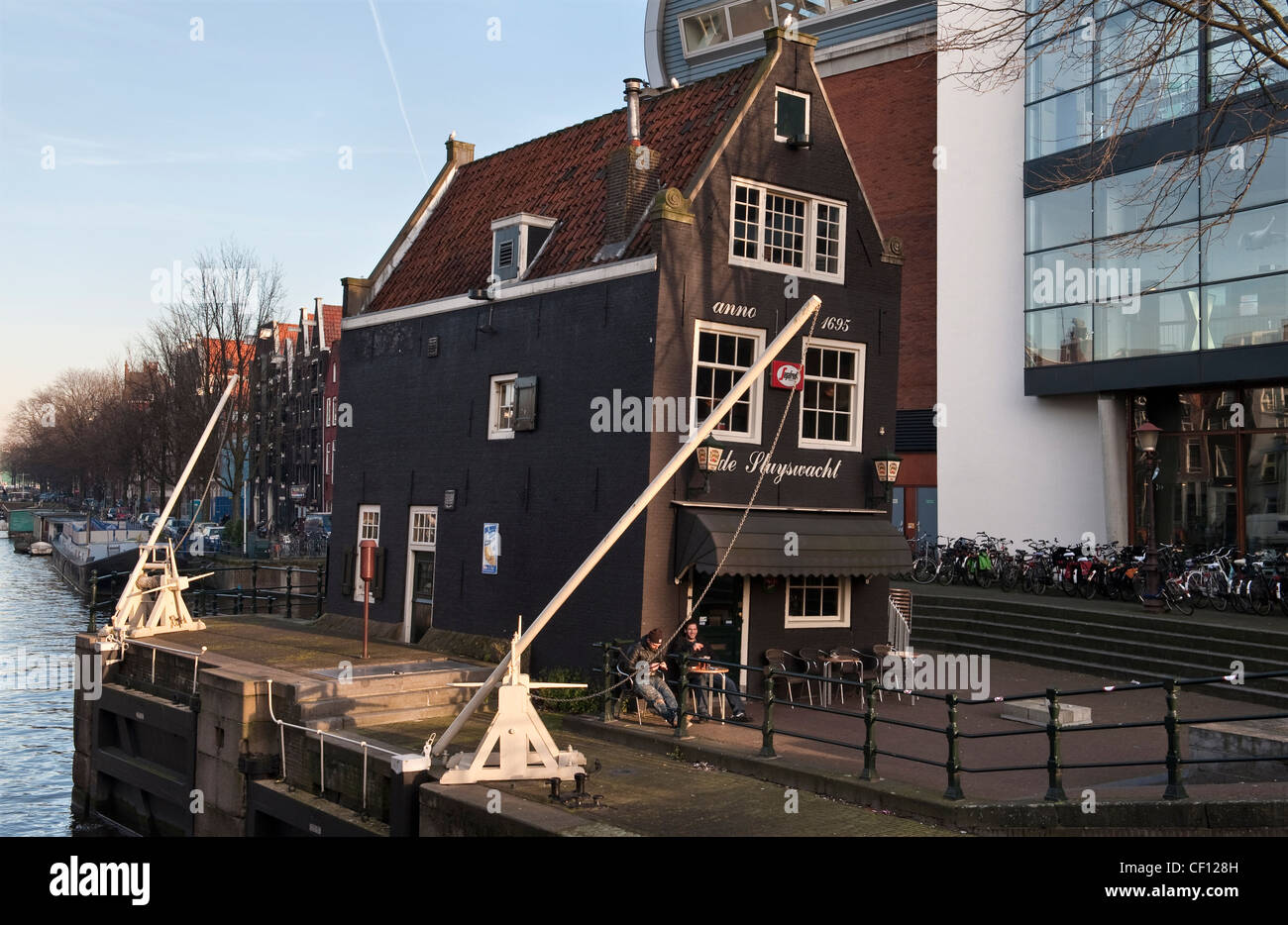 The Cafe de Sluyswacht in Amsterdam, the Netherlands, dates from 1695 and was originally the lockmaster's house (sluyswachterhuisje) Stock Photo