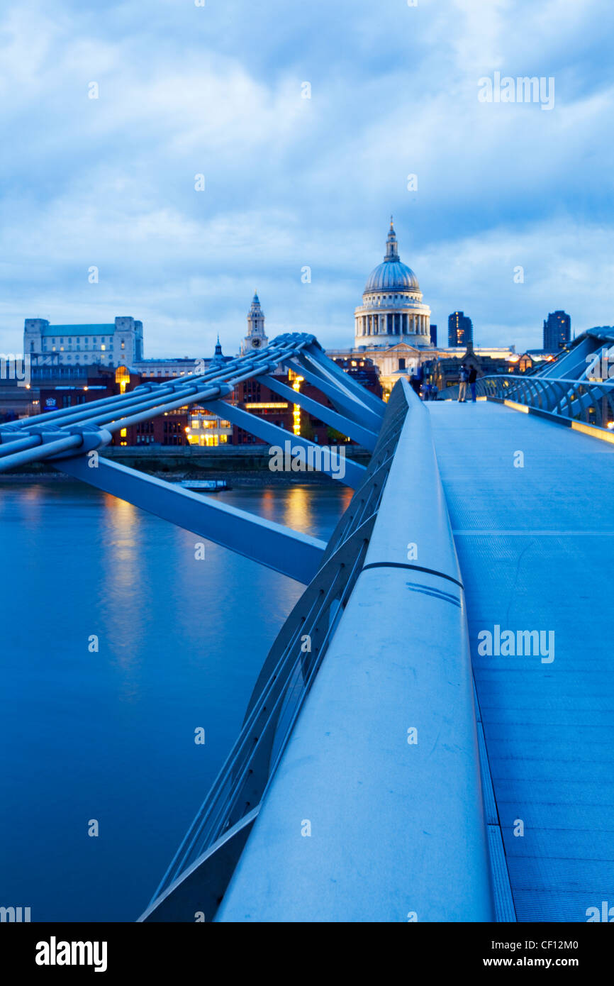 A view of St Paul's cathedral from the Millennium Bridge with the River Thames below. Stock Photo