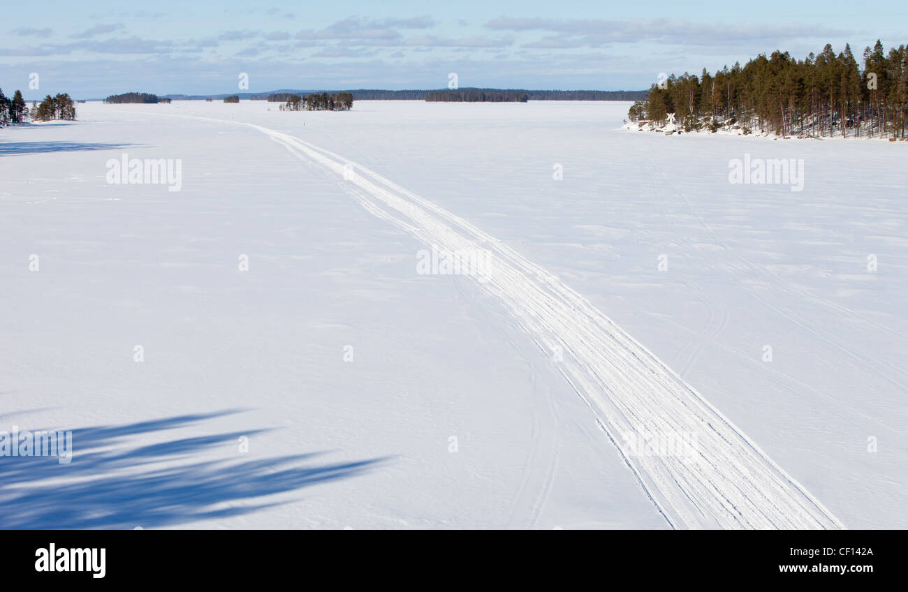 Aerial view of a snowmobile route on lake ice at Winter , Finland Stock Photo