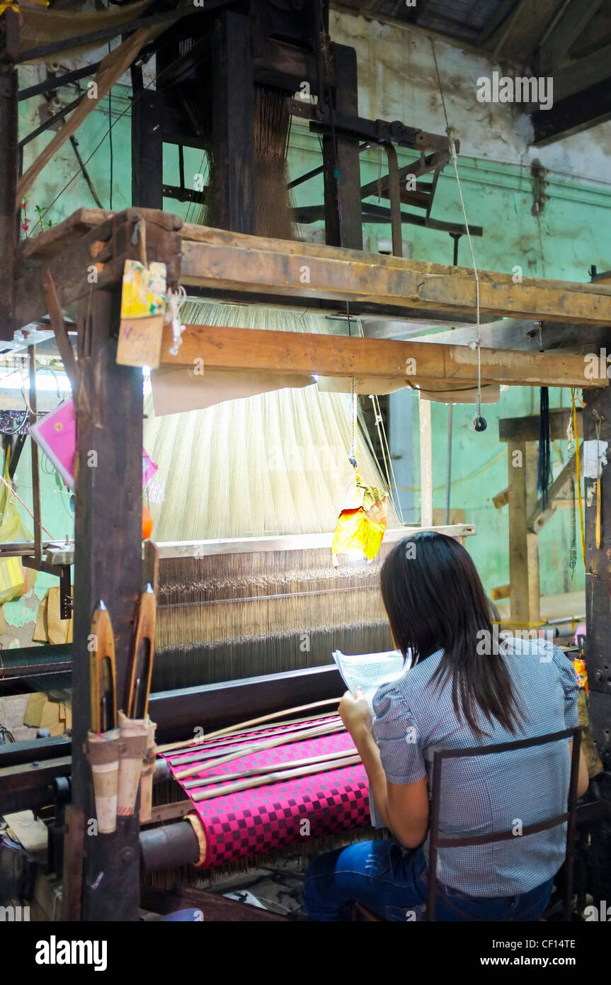 Woman working at loom, silk factory, Hanoi, Vietnam, South East Asia Stock Photo