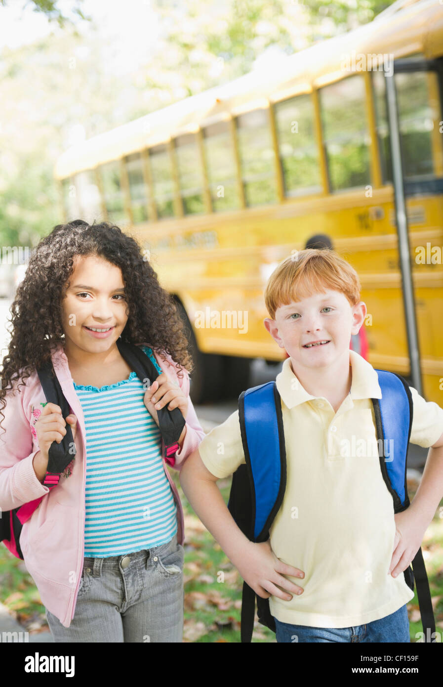 Two school children waiting for bus hi-res stock photography and images ...