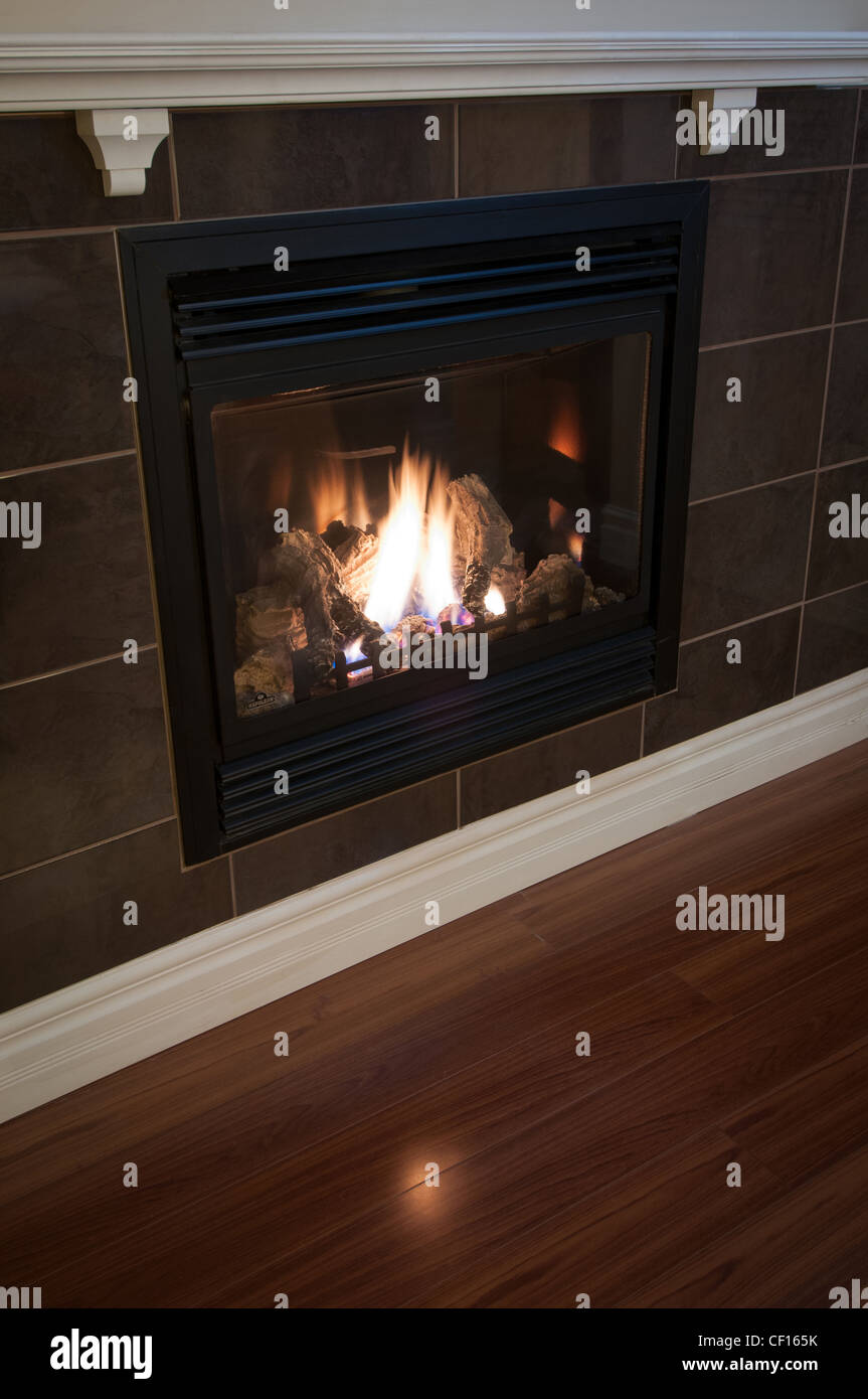 Gas burning fireplace in luxury residential home. Stock Photo