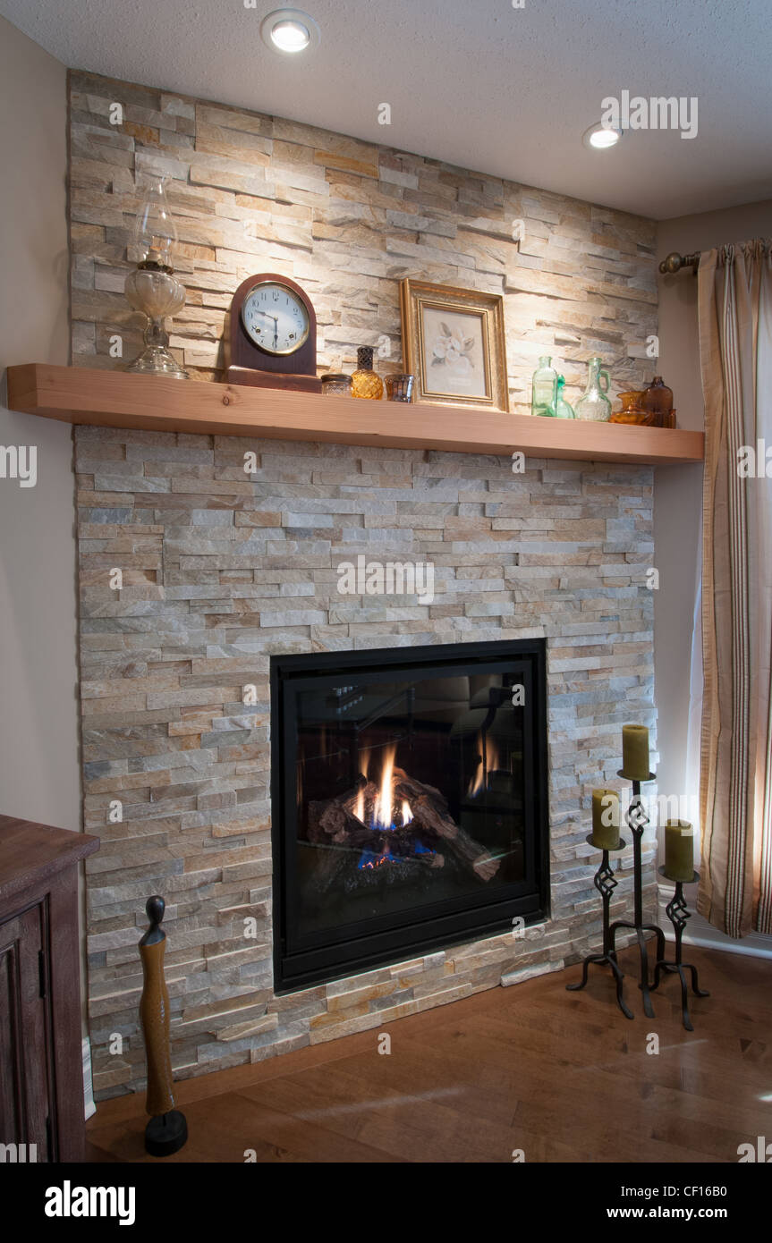 Gas burning fireplace in luxury residential home. Stock Photo