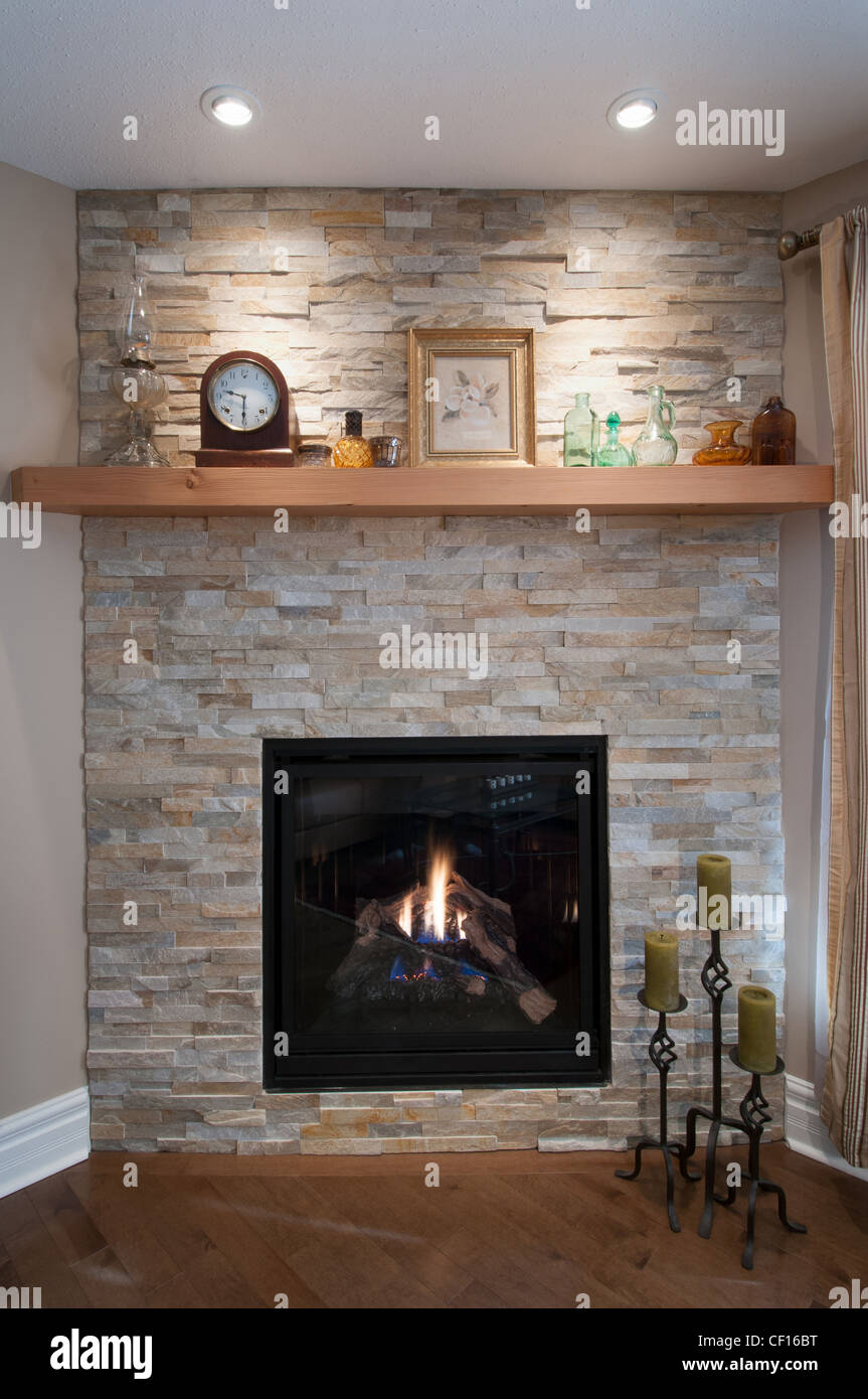 Gas burning fireplace in luxury residential home. Stock Photo