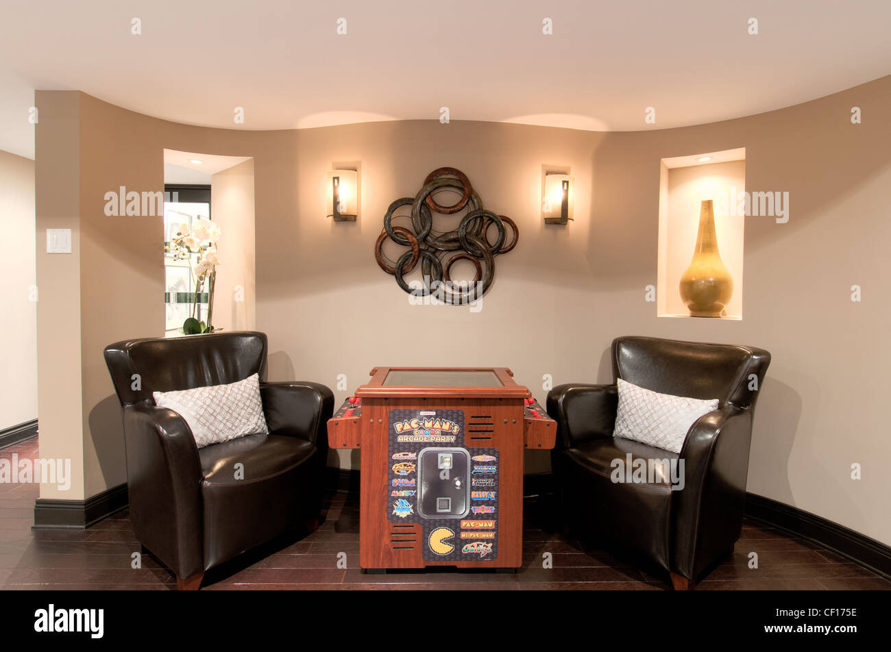 Vintage arcade machine in a luxury residential home. Stock Photo