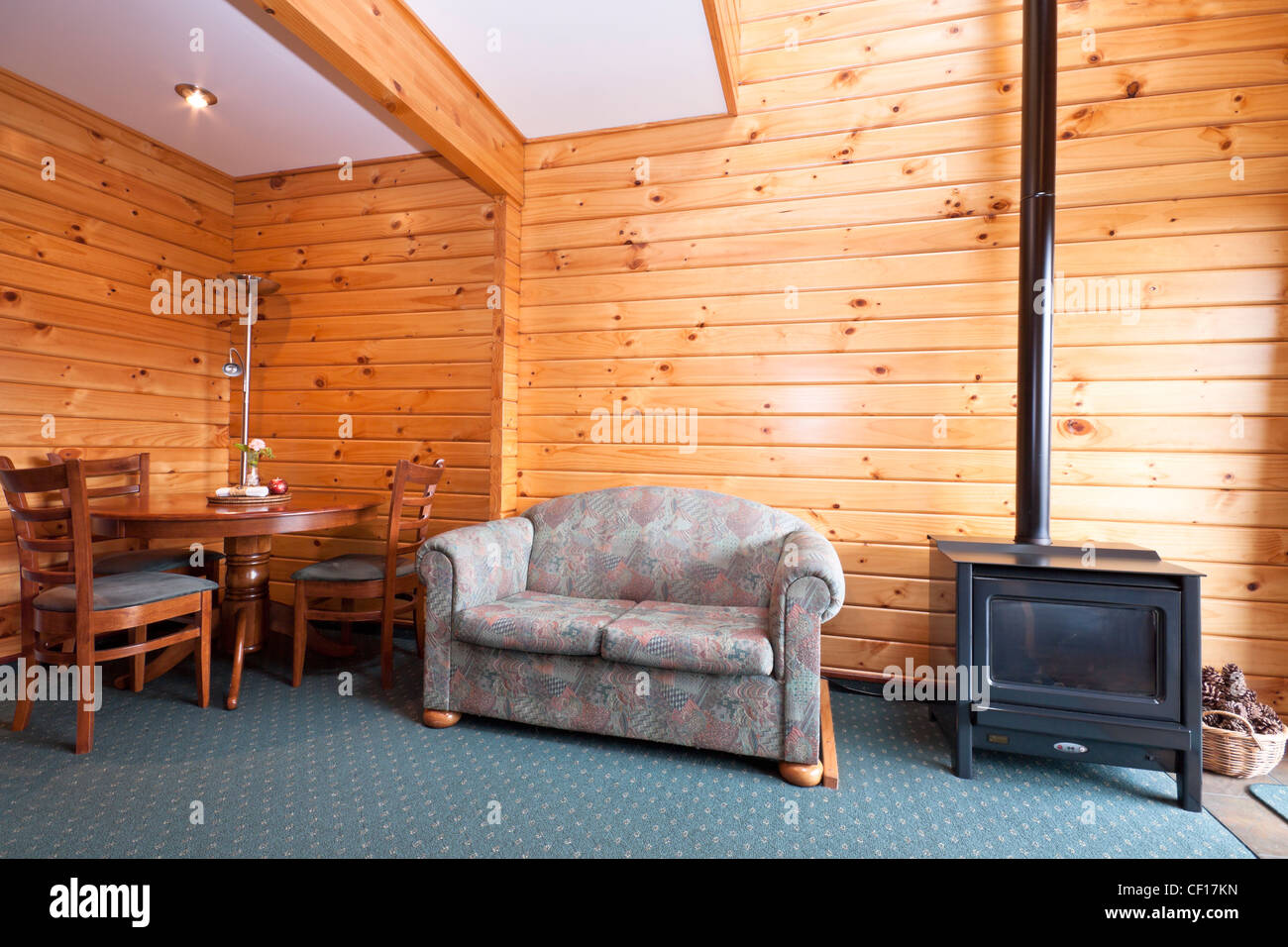 Lodge apartment interior with fireplace. Fox Glacier Lodge, Fox Glacier, West Coast, South Island, New Zealand. Stock Photo