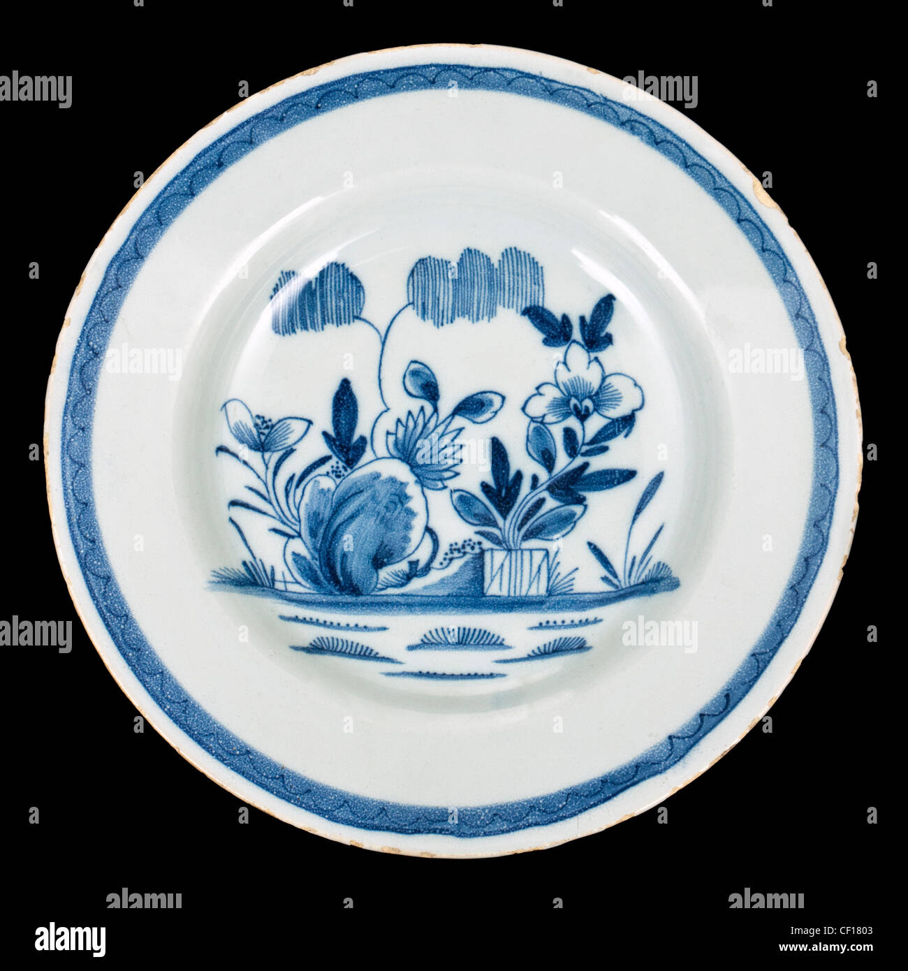 Antique Delft plate with painted underglaze Chinoiserie style flowers Stock Photo
