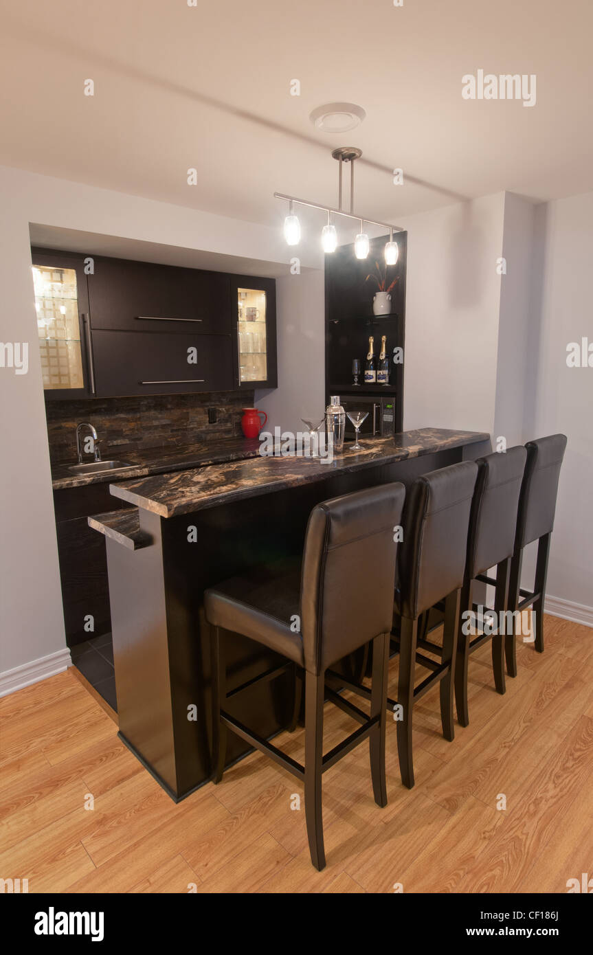 Luxury basement bar with stools and martini glasses Stock Photo Alamy