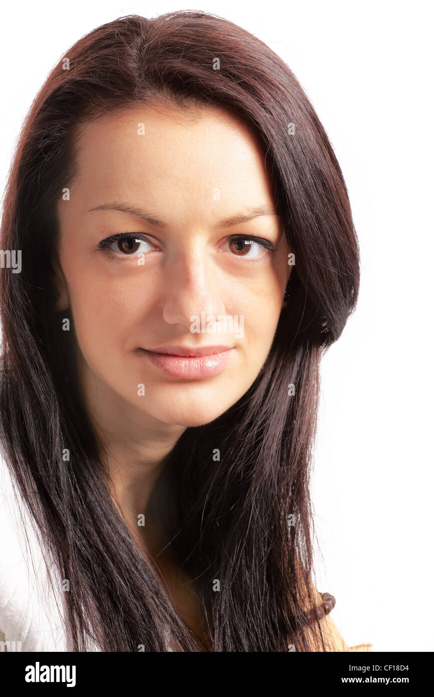 Studio portrait of a beautiful 20 year old brunette against white. Stock Photo