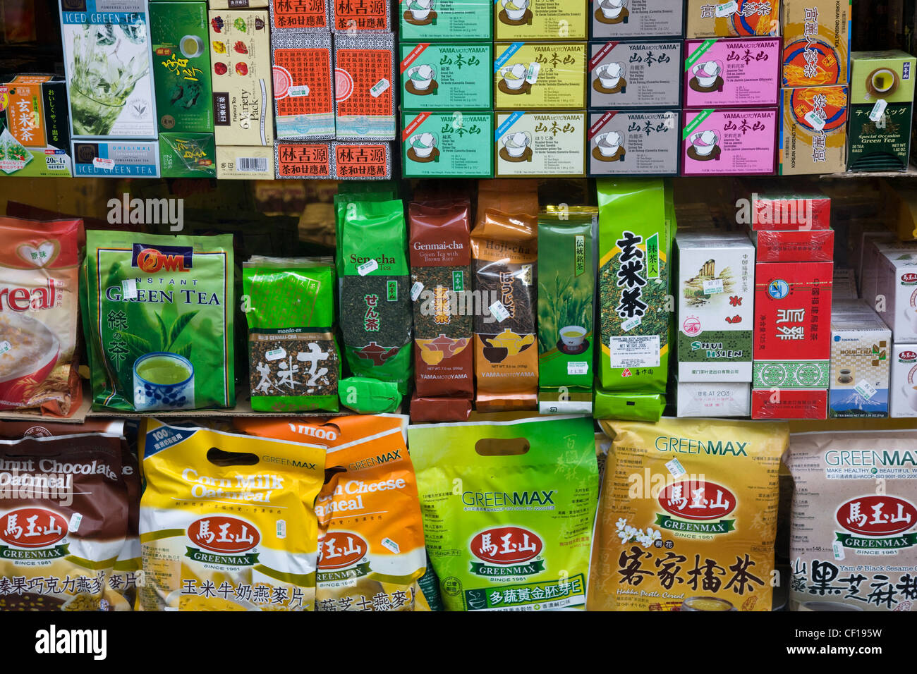 Shop window in Chinatown, London, with a range of Chinese teas, herbs, rice crackers and biscuits Stock Photo