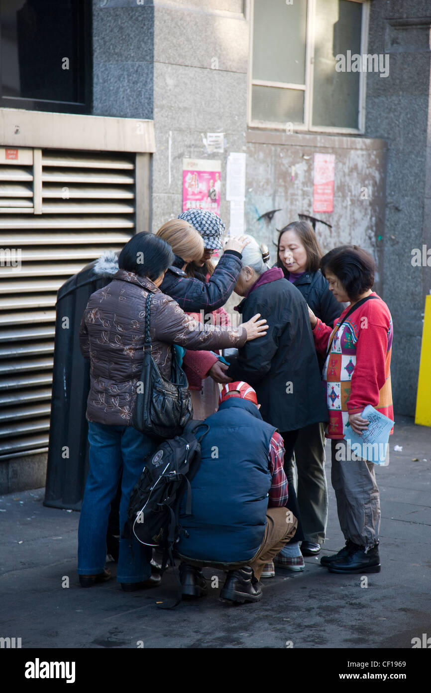 Chinese people in group hug, Chinatown, London Stock Photo Alamy