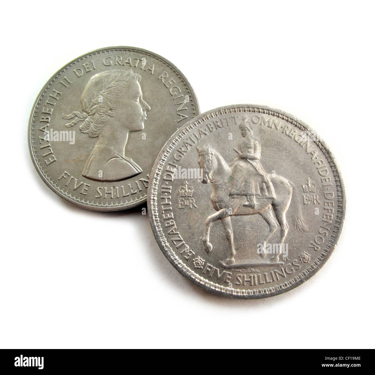 A British  jubilee crown coin of Queen Elizabeth II in the foreground with another crown showing her profile as a young queen. Stock Photo