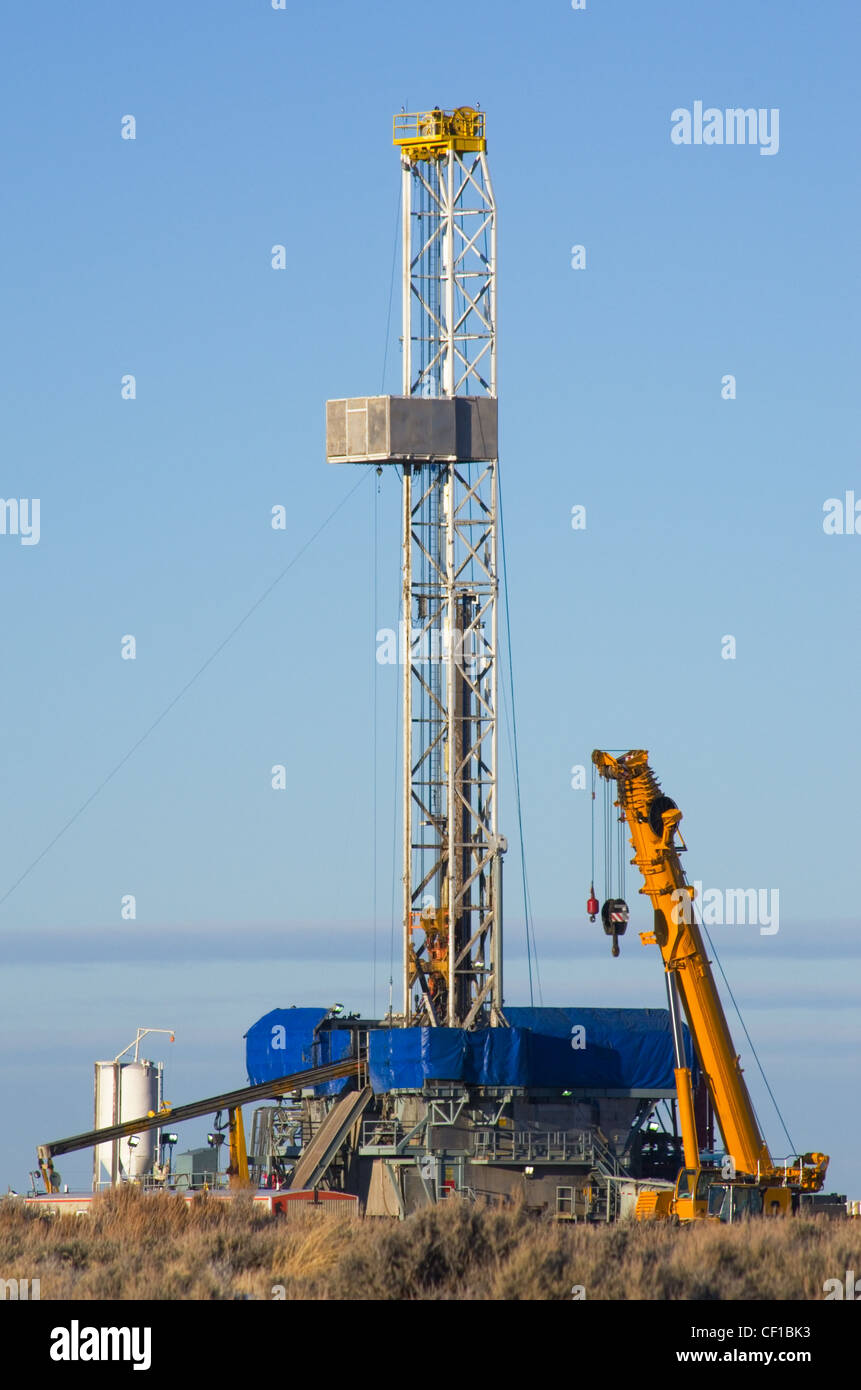 drill rig set up for winter drilling in Wyoming Stock Photo