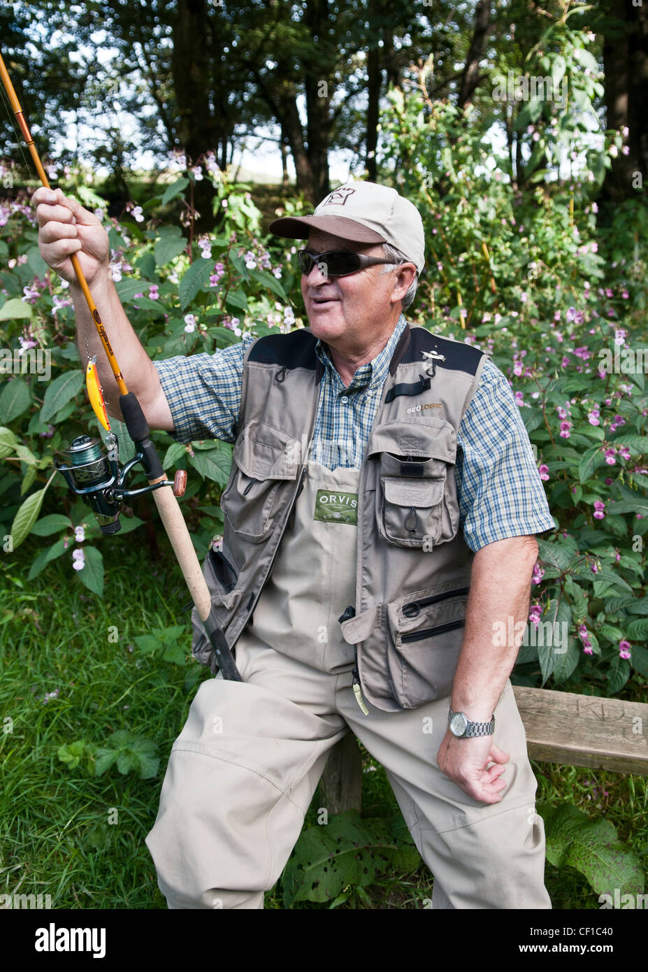 A retiree spends his time fly fishing andother  leisure activities Stock Photo