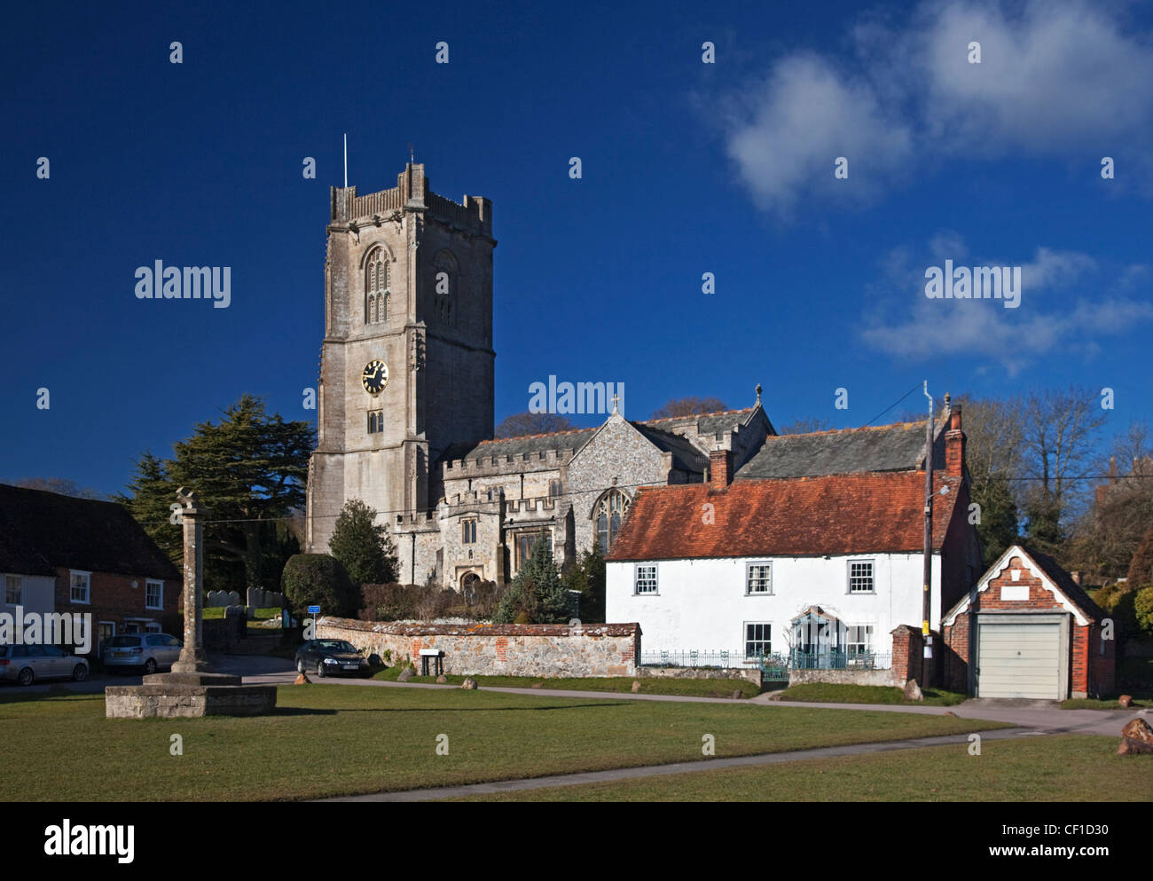 The parish Church of St Michael by the village green. Stock Photo
