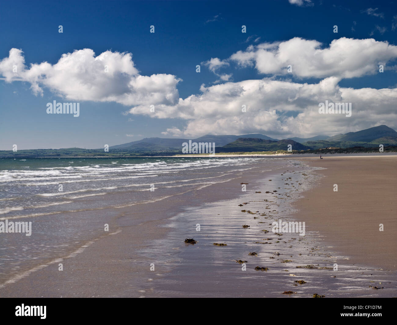 Waves rolling onto the foreshore of Harlech Beach. Stock Photo