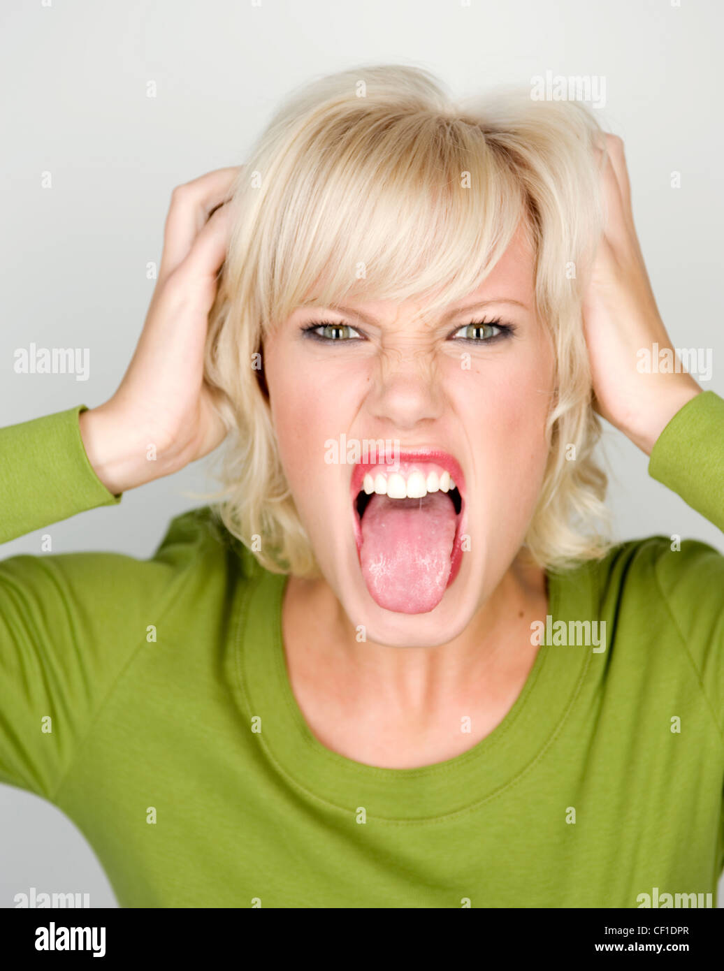 Female sticking tongue out Stock Photo
